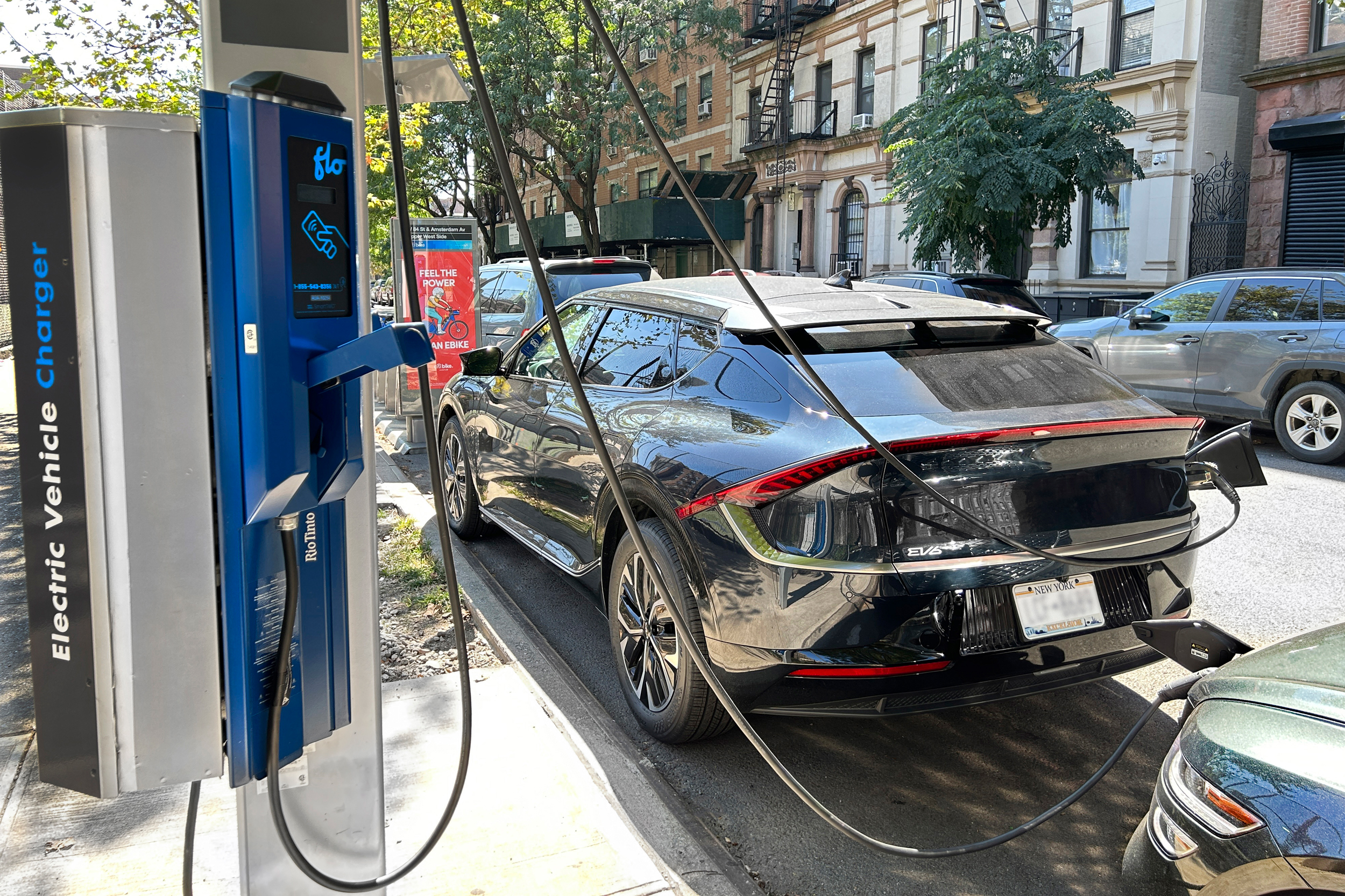 Electric car connected at charging station, New York City, New York. (Photo by: Plexi Images/Glasshouse Images/UCG/Universal Images Group via Getty Images)
